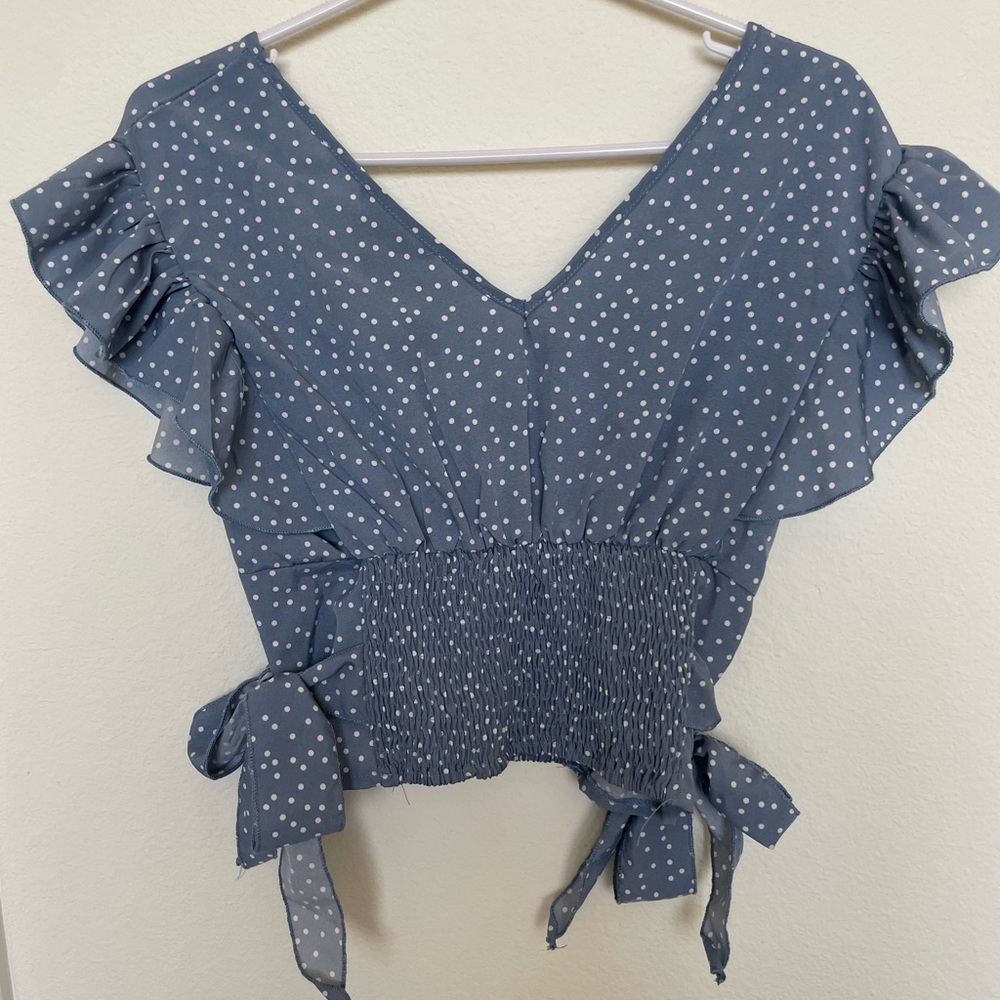 Blue polka dot polyester cropped top with tied sides